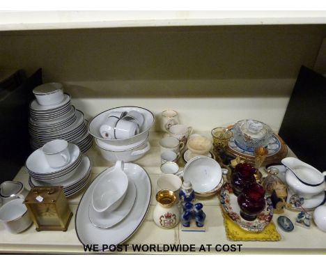 A Bohemia design dinner service comprising dinner plates. bowls, cups, saucers and a lidded tureen, together with commemorati