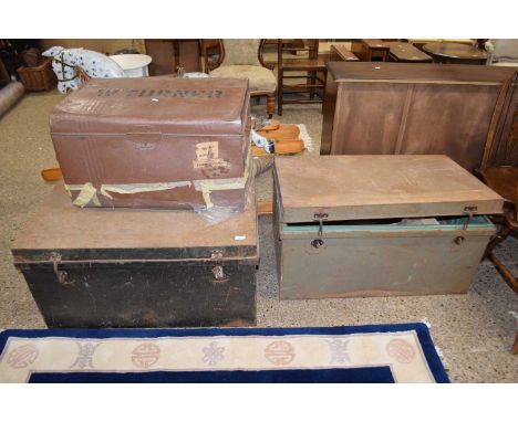 A group of three vintage metal trunks 
