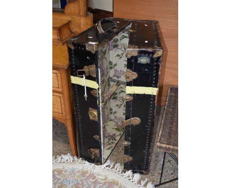 A vintage travel trunk with fitted interior