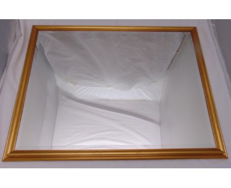 A rectangular gilded wooden framed wall mirror, 84.5 x 110cm