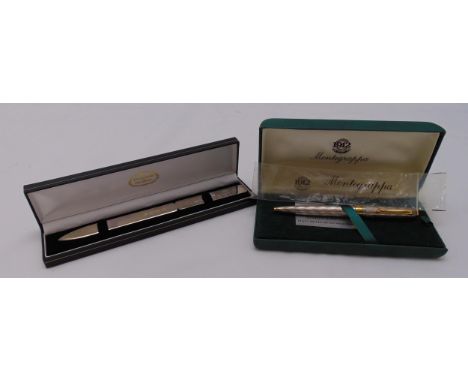 Montegrappa ballpoint pen in original packaging and a white metal paper knife