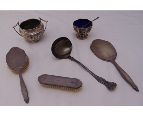 A quantity of hallmarked silver to include a soup ladle, sugar bowls and a dressing table set (6)