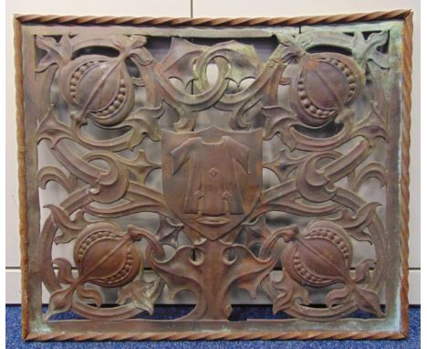 A rectangular copper panel pierced and embossed with stylised leaves and strapwork within rope twist border, 61 x 73cm