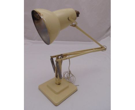 A mid 20th century cream angle poise table lamp on stepped square base A/F