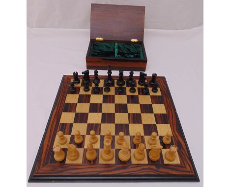 A cased wooden chess set of traditional form with matching two wood chess board, the King 9.5cm (h)