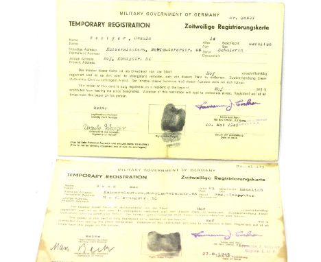 American WWII pair of 1945 dated Military Government of Germany occupation passes, each laminated. P&amp;P Group 1 (£14+VAT f