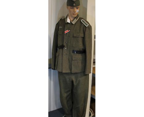 German WWII SS representation uniform, near-complete comprising badged and buttoned tunic with epaulettes, badged side cap an