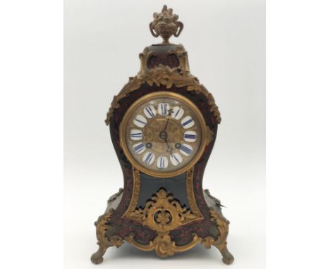 A 19th century Rococo style ormolu mounted and boulle inlaid mantel clock. H.34cm.