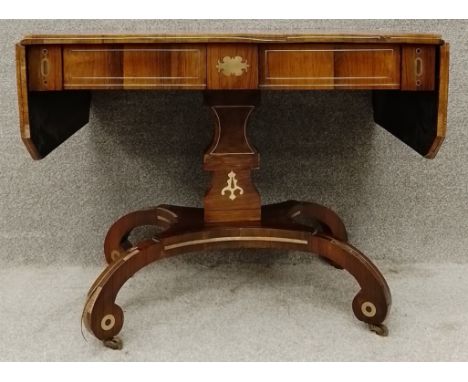 A Regency rosewood drop flap sofa table with brass inlay raised on quadruped pedestal base. H.71 W.89 (138 ext) D.63cm