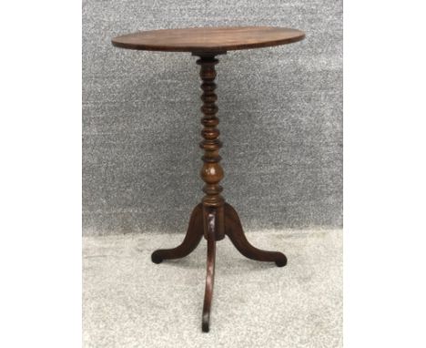 A 19th century oak lamp or occasional table on tripod base. H.74cm.