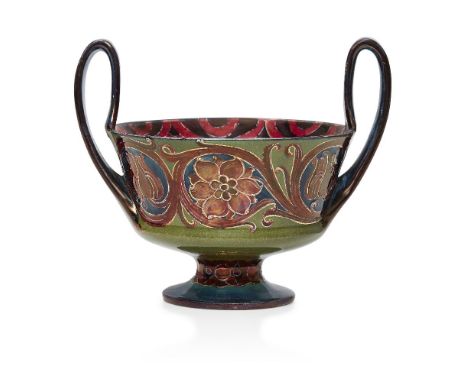 William Moorcroft (1872-1945), a twin-handled ceramic bowl with red lustre     c.1910, signed in green W Moorcroft, printed M