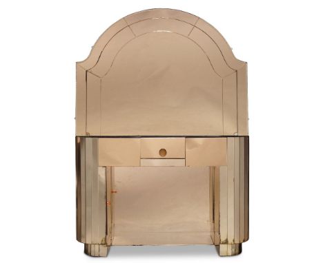 English Art Deco, a peach mirror-glass dressing table and mirror    c.1930    The arched mirror above bow-fronted dressing ta