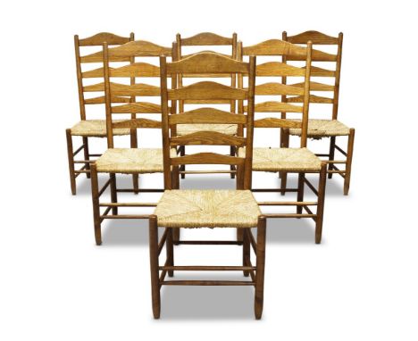A set of six Gimson style ladder back chairs by Neville Nealc.1980, three chairs stamped  With shaped ladder backs, above rus