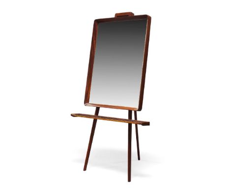 Italian, a mahogany framed mirror on stand    c.1950    The rectangular mirror above narrow shelf, raised on folding stand wi