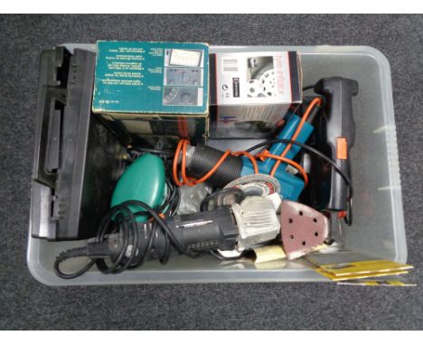 A crate of tools, disc sander, tire inflator etc 