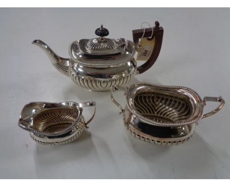 A three piece silver bachelor's tea service, Richard Richardson Sheffield 1898, 654.7g. (3)