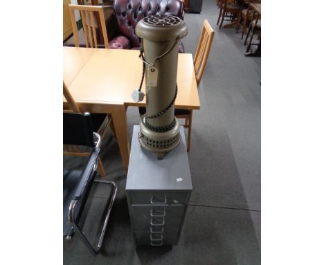 A vintage floor standing electric heater together with a metal six drawer chest 
