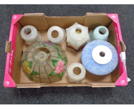 A crate of glass light shades