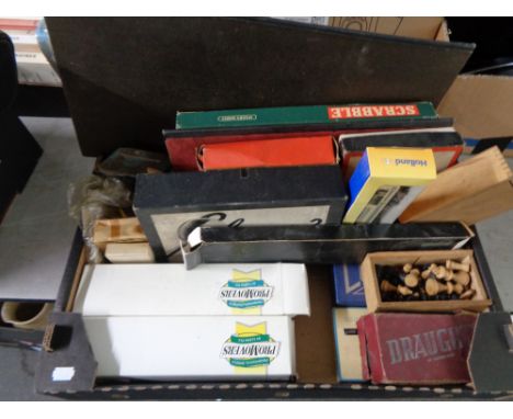 A box of board games, Scrabble, Cluedo, vintage wooden chess pieces etc  CONDITION REPORT: The chess set is complete. 