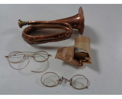 A miniature copper and brass bugle, antique spectacles, commemorative crowns 