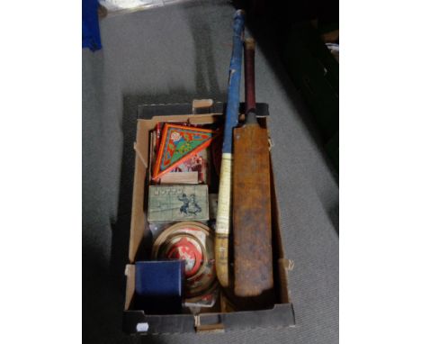 A box of vintage games, old Slazenger cricket bat, hockey stick, Waddington playing cards etc 