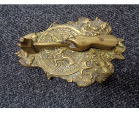 A nineteenth century brass door knocker 