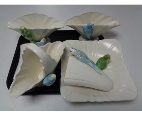 A tray of ceramic budgerigar, vases and wall pockets  CONDITION REPORT: Most parts are discoloured and crazed but no clear br
