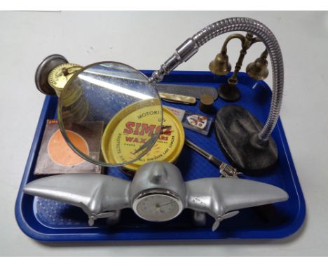 A vintage car wax tine clock, novelty aircraft clock, miniature lamp etc 