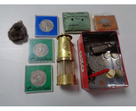 An Oxo tin containing crowns, coins, miniature brass lamp, National Saving Collector's bank 