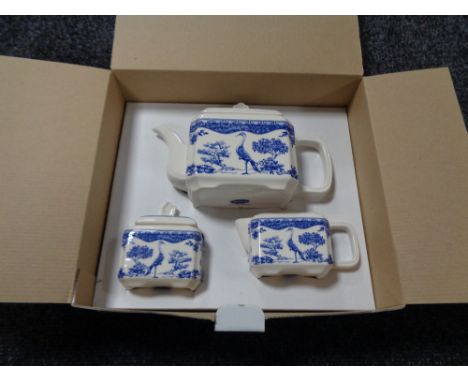 A Wade blue and white teapot, sugar basin and cream jug, in retail box.