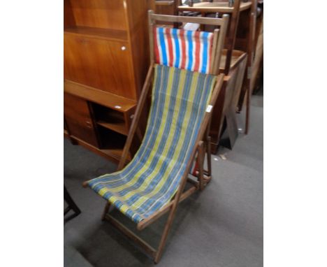 Two vintage wooden folding deck chairs