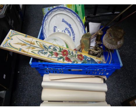A crate of antique blue and white plate, tile plaques, gun cleaning rod, brass lamp etc