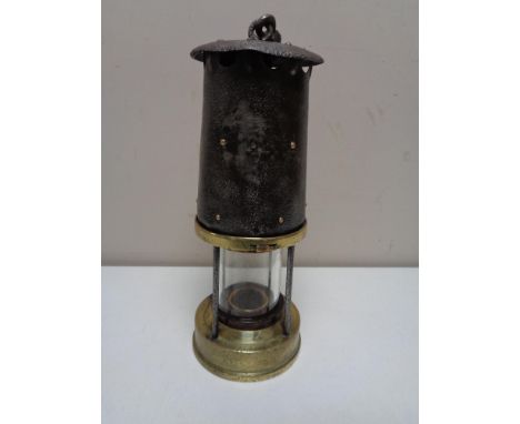 An early twentieth century brass protector miner's lamp 
