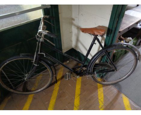 A vintage bicycle with leather saddle 