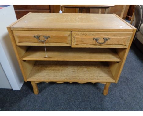 A light oak side table fitted with two drawers 