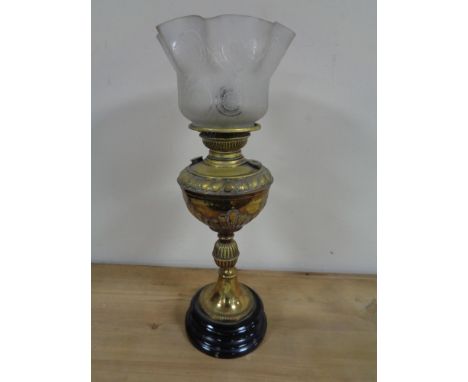 An Edwardian brass oil lamp with glass shade 