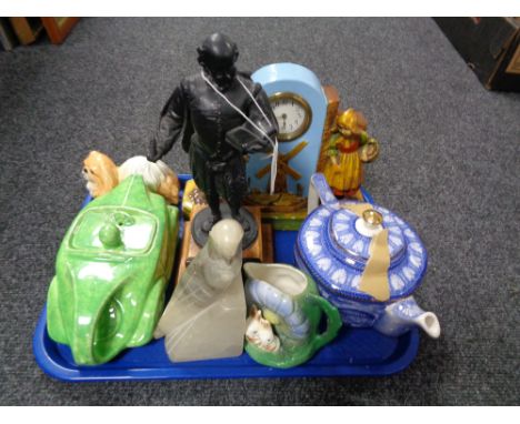 A tray of metal figure on plinth, Ringtons china teapot, ceramic table clock, Saddler teapot