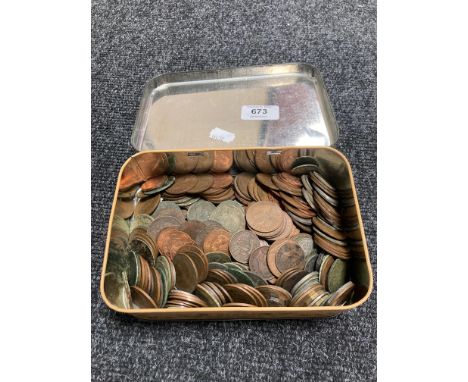 A vintage tin of coins, pennies and half pennies 
