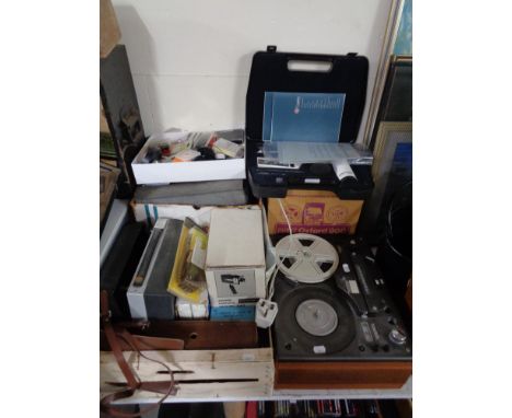 A Tandberg stereo reel-to-reel player,  together with a Filmosound movie camera, Bell and Howell movie light, etc. (Q)   