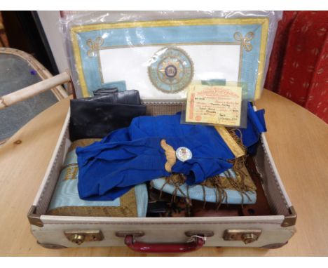 A vintage suitcase containing Masonic apron, and memorabilia 