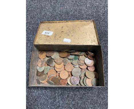 A vintage tin of coins, pennies and half pennies 
