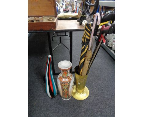An embossed brass stick pot, ceramic vase, glass art vase, littler pickers etc 