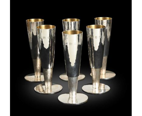 § A set of six Elizabeth II silver champagne flutes by Gerald Benney CBE (1930-2008),London, 1964, retailed by Hardy Brothers