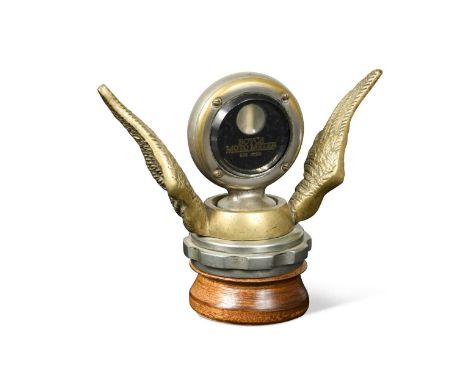A Gem Model Boyce Motometer temperature gauge, the chromed circular gauge display flanked by a pair of brass wings, mounted a
