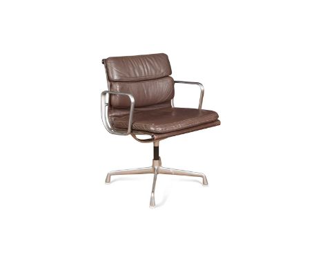 Charles and Ray Eames for Herman Miller, EA108, an aluminium group swivel desk chair with brown leather upholstery, moulded m