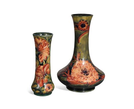 Two Moorcroft Spanish pattern vases, the first of compressed mallet form and decorated over a mottled green ground, impressed