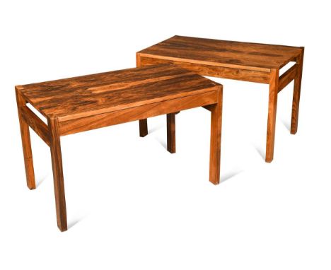 A pair of mid-century rosewood metamorphic lamp tables, each of unusual configuration having a lift-out bookmatched rosewood 