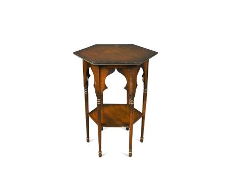 A Moorish oak occasional table, probably retailed by Liberty &amp; Co.,  with hexagonal top on ring turned supports69 x 55 x 