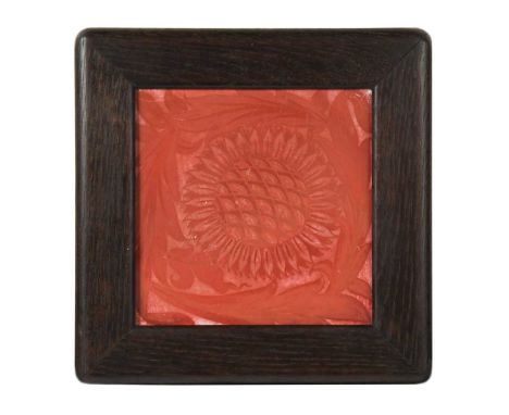 William De Morgan at Sands End, a framed ruby lustre tile, decorated with a sunflower head and foliage after a design by Will