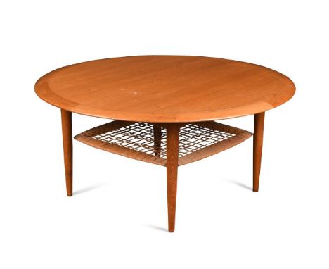 Johannes Andersen for CFC Silkeborg, a teak coffee table, with circular top above a caned under-tier, label to underside47 x 